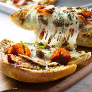 Garlic bread with pizza toppings fresh out of the oven.