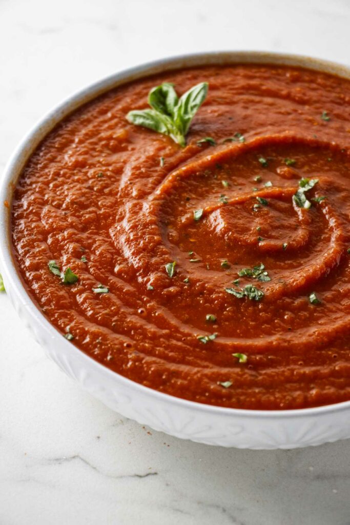 A bowl of pizza sauce made from fresh tomatoes.