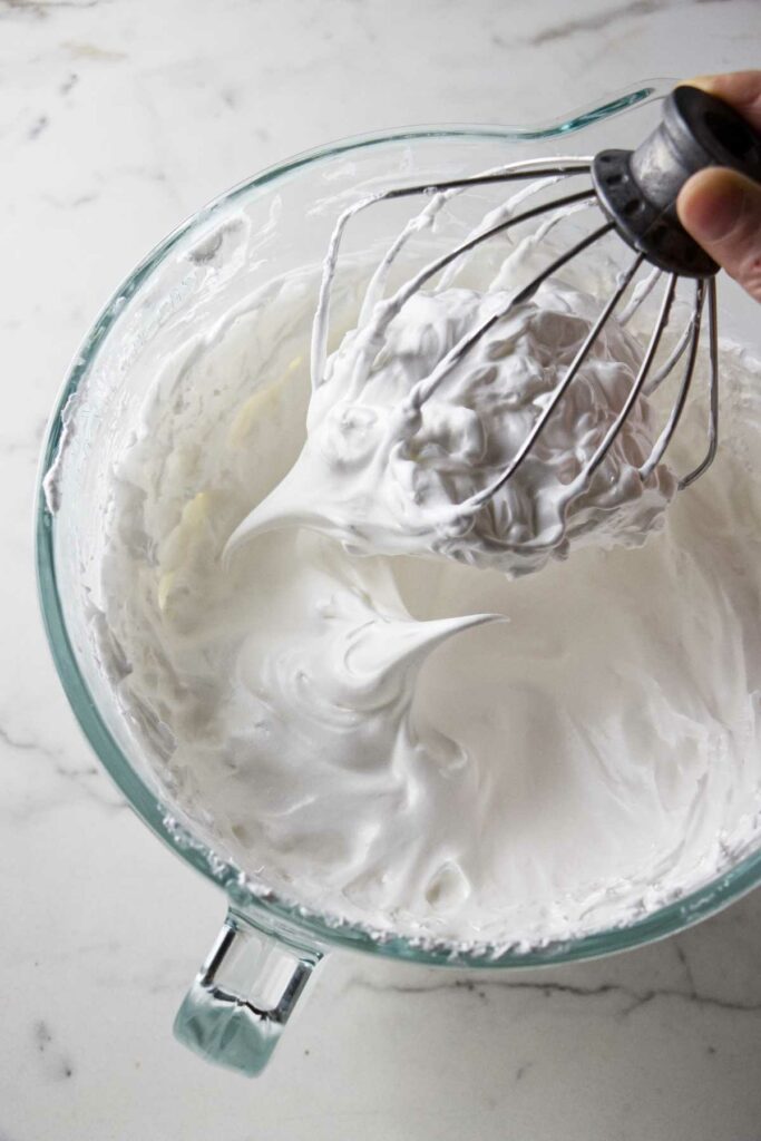A mixing bowl filled with stable meringue.