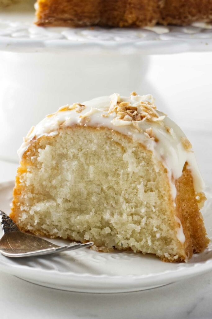A slice of a bundt cake with coconut.
