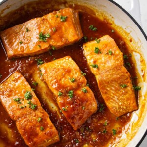 Marsala salmon in a skillet.