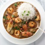 Seafood gumbo with a serving of white rice.