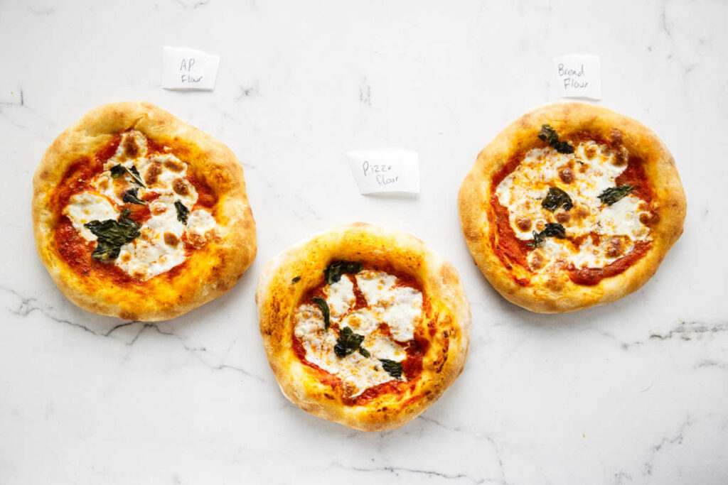 Three pizzas made from different types of flour.