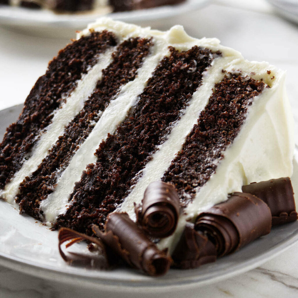 A four layer chocolate cake with cream cheese frosting and filling.
