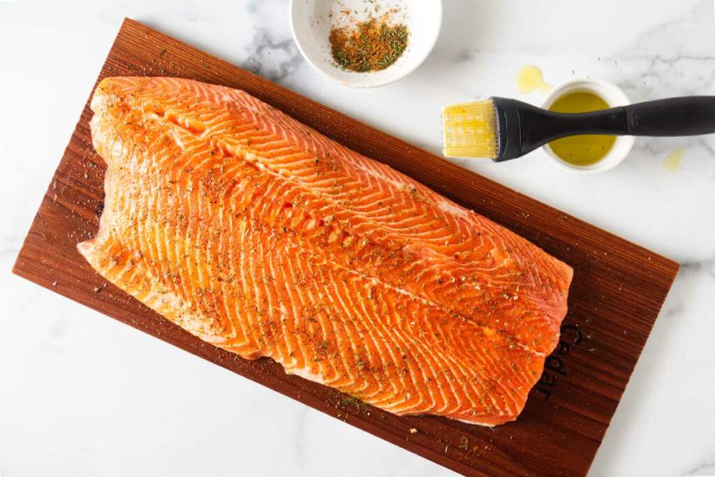 A trout fillet on a cedar plank.