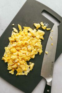 Chopping the scrambled eggs.