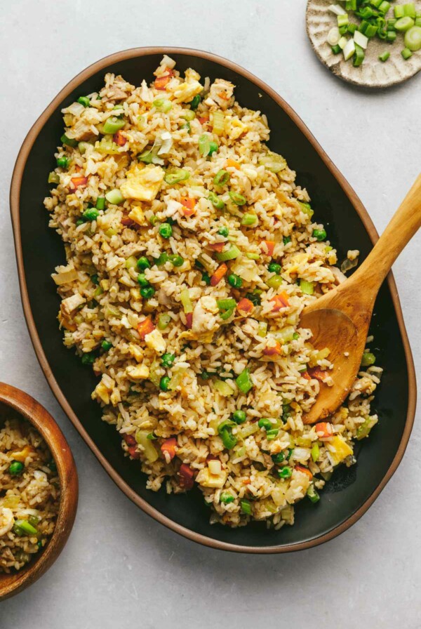 A serving plate with chicken fried rice.