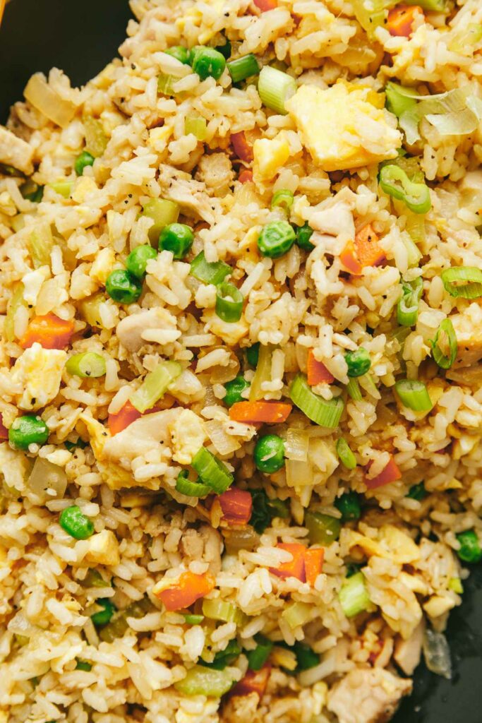 A serving of chicken vegetable fried rice.