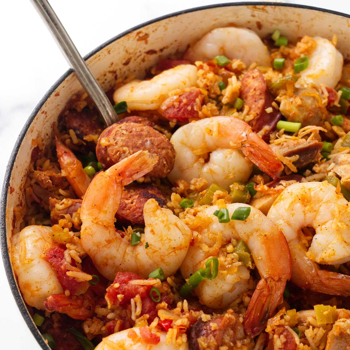 A traditional jambalaya recipe in a skillet.