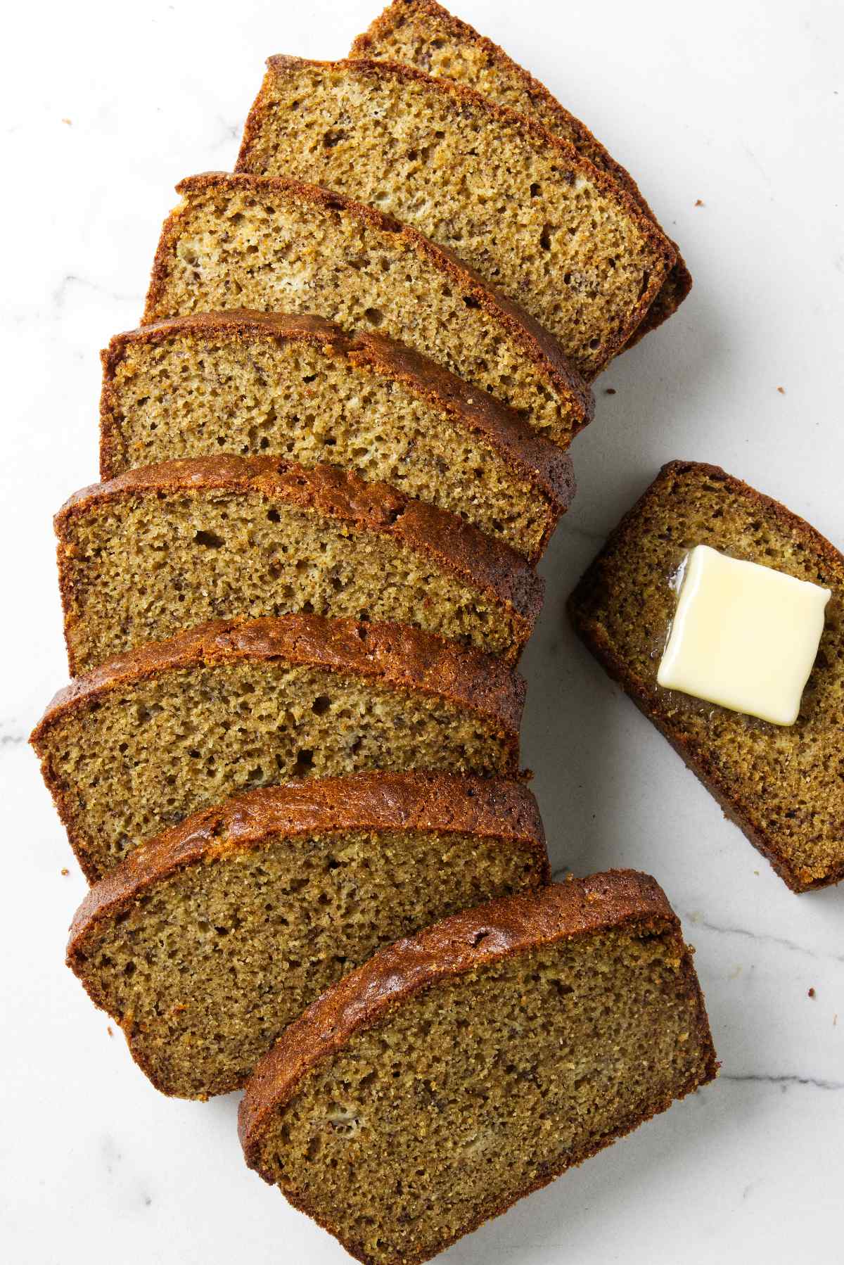 Slices of banana bread on a counter.