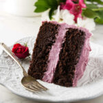 A slice of chocolate red wine cake with wine buttercream.