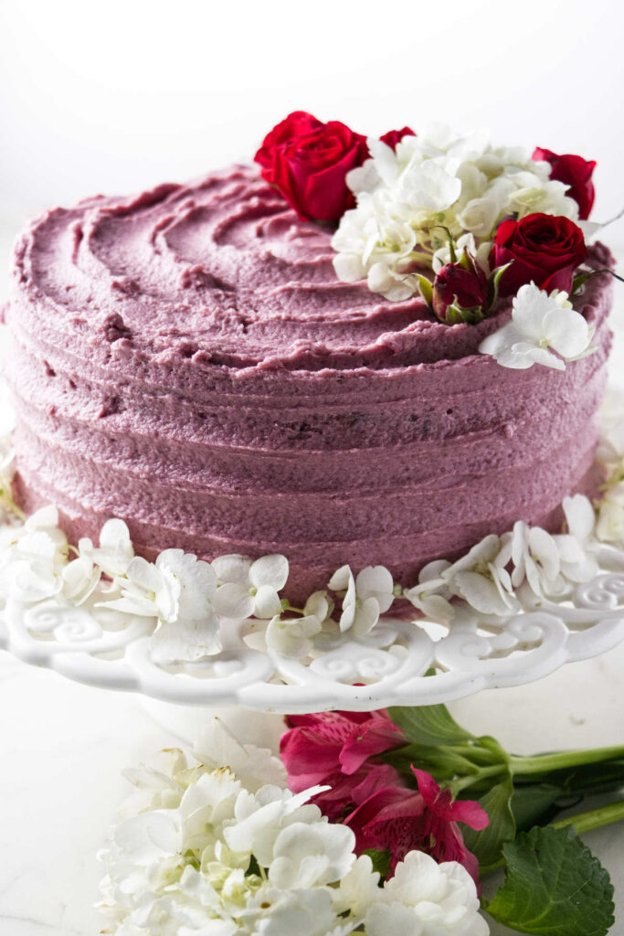 A red wine chocolate cake decorated with flowers.