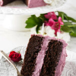 A slice of red wine chocolate cake on a plate.