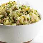 A bowl filled with Hawaiian potato salad with macaroni.