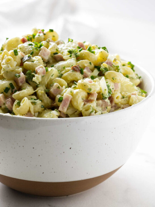 A bowl filled with Hawaiian potato salad with macaroni.