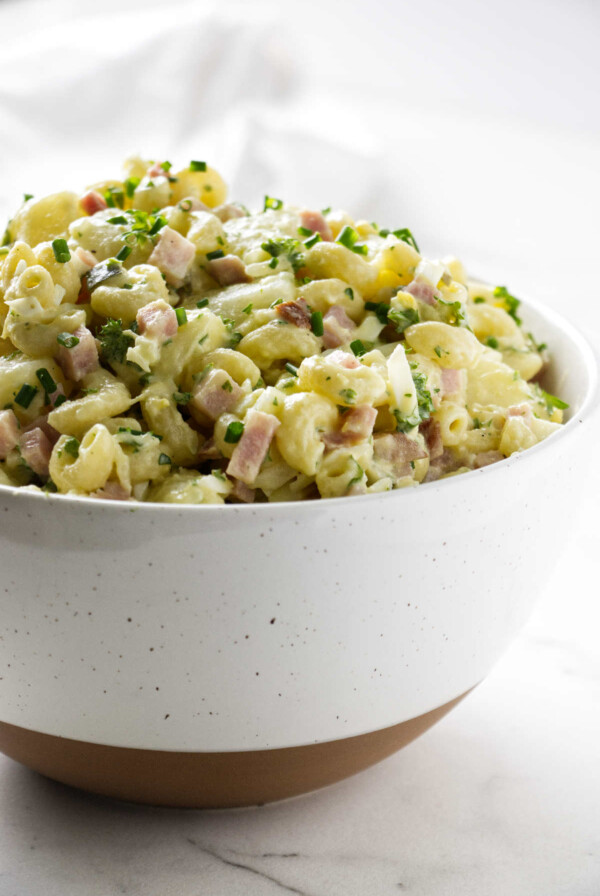 A bowl filled with Hawaiian potato salad with macaroni.