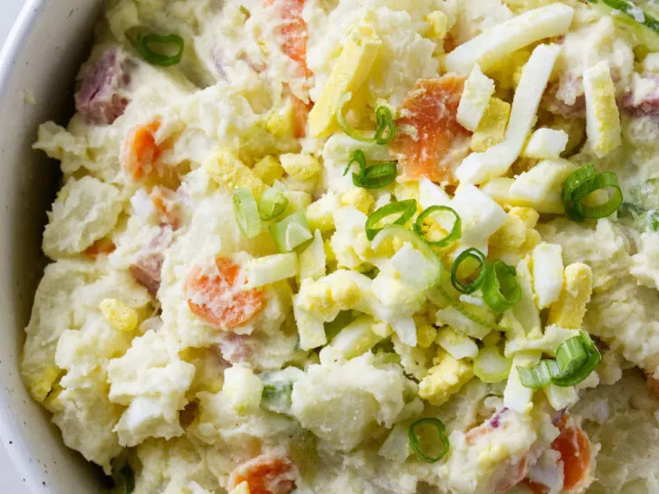 A serving bowl filled with Japanese potato salad.