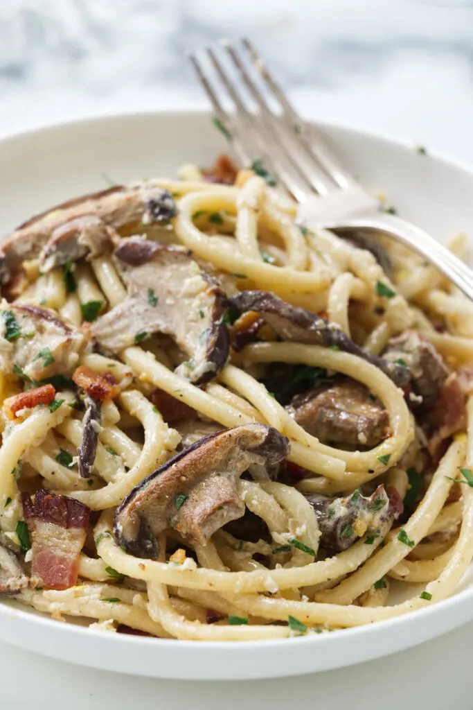 a dish filled with wild mushroom pasta.