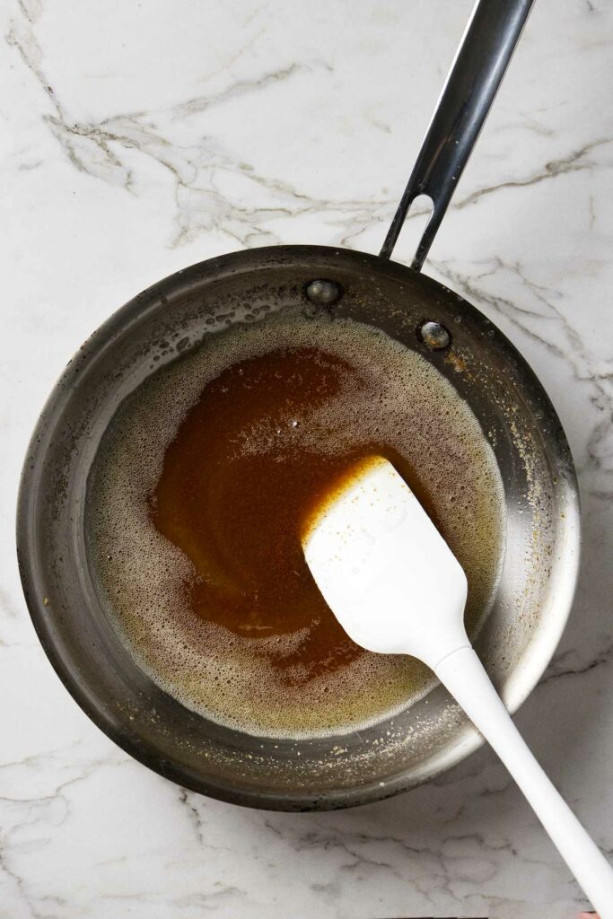 Making brown butter in a saucepan.