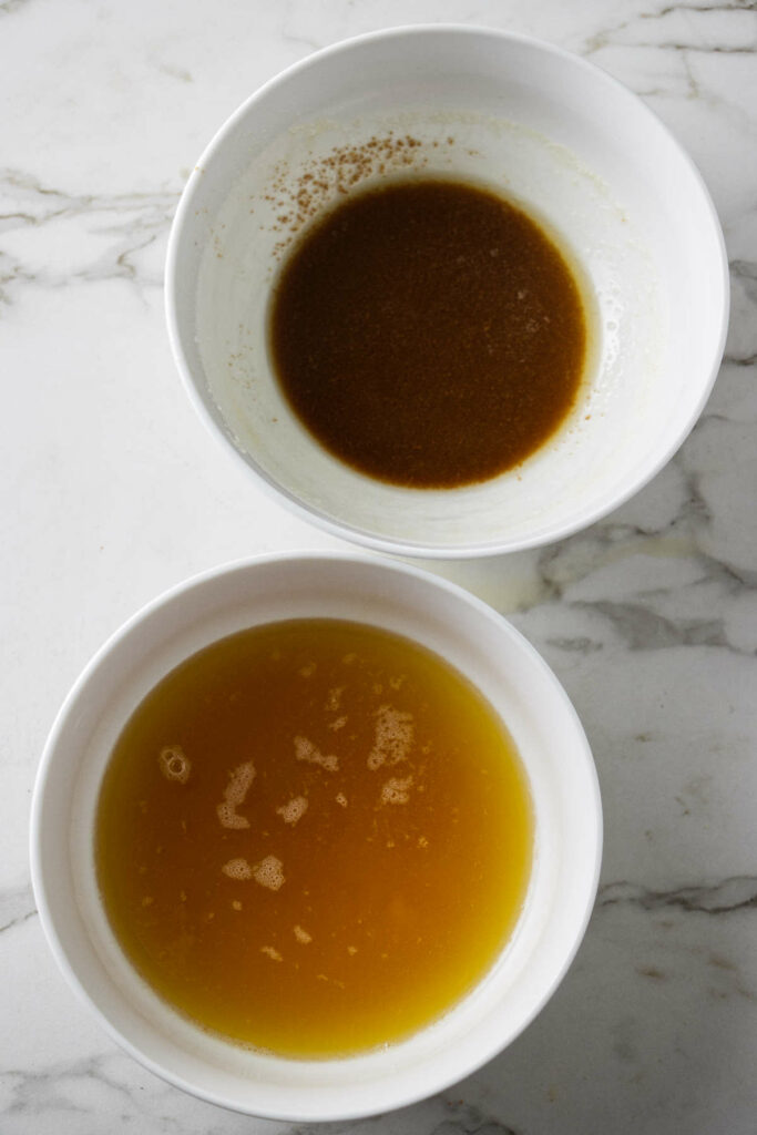 Separating the brown milk solids from the clarified butter after making brown butter.