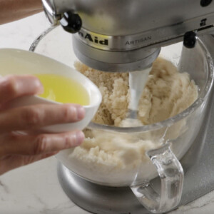 Adding egg whites to the cake batter.