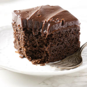 A partially eaten slice of einkorn chocolate cake.