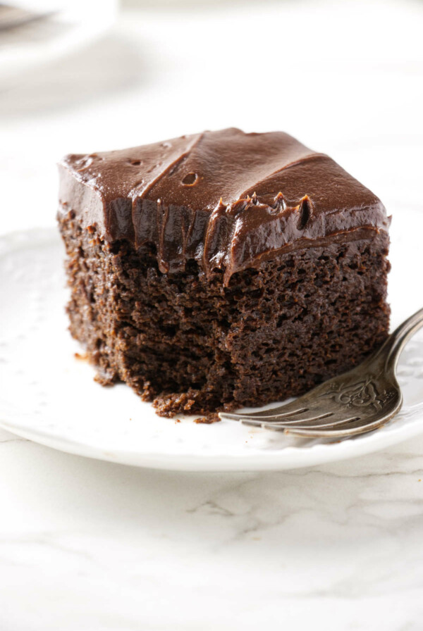 A partially eaten slice of einkorn chocolate cake.