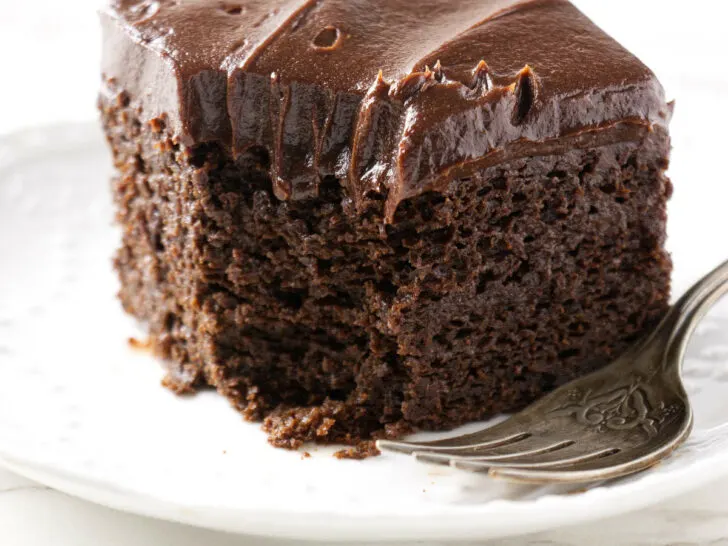 A partially eaten slice of einkorn chocolate cake.