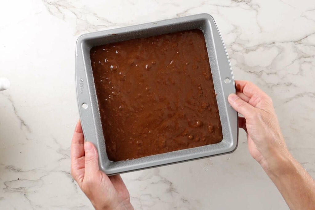 Cake batter in a baking pan.