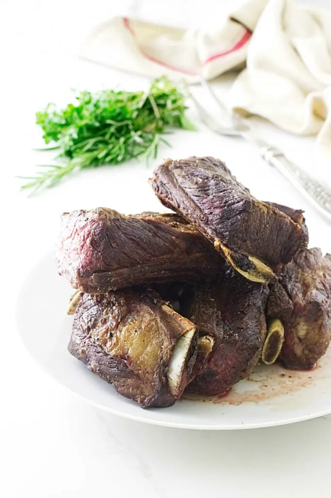 Beef short ribs on a plate.