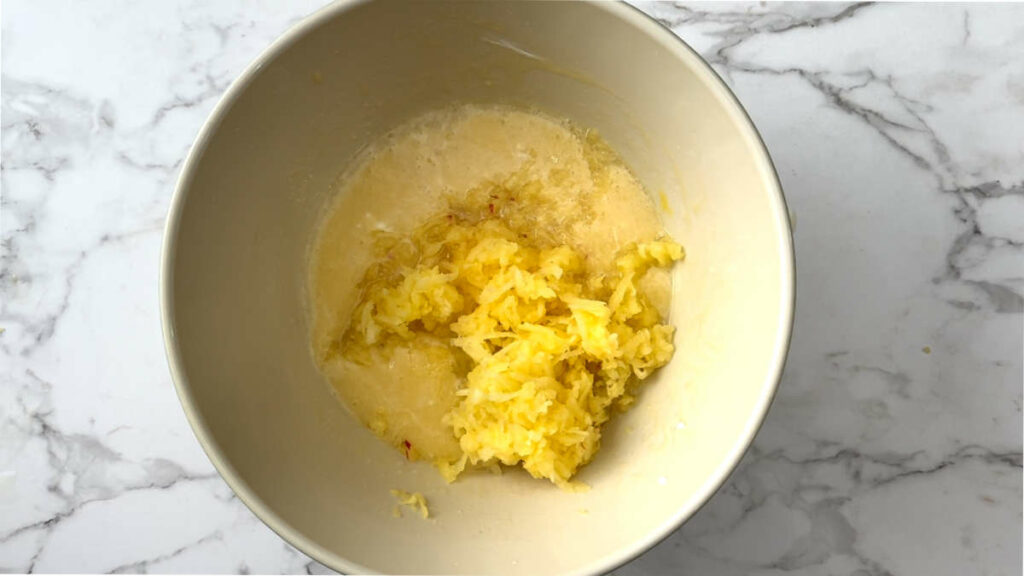 Adding apples to a quick bread batter.