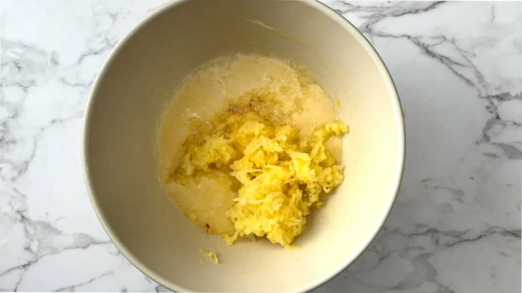 Adding apples to a quick bread batter.