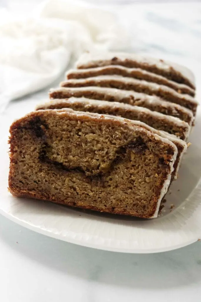 Several slices of an apple loaf with a cinnamon swirl.