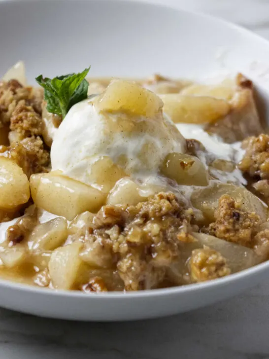 A warm pear crisp with fresh pears.