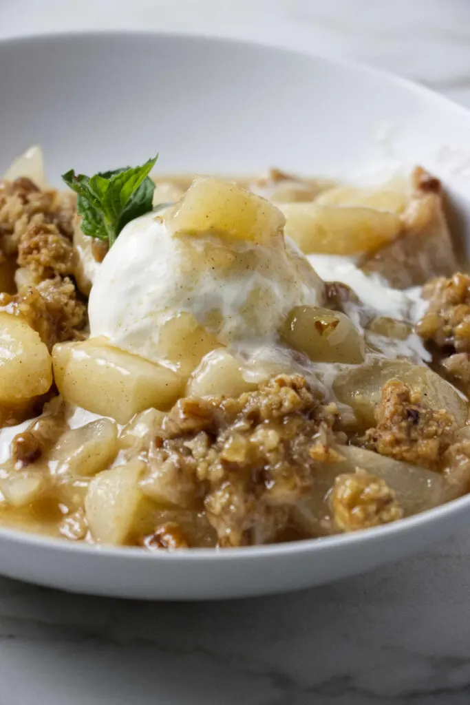 A warm pear crisp with fresh pears.