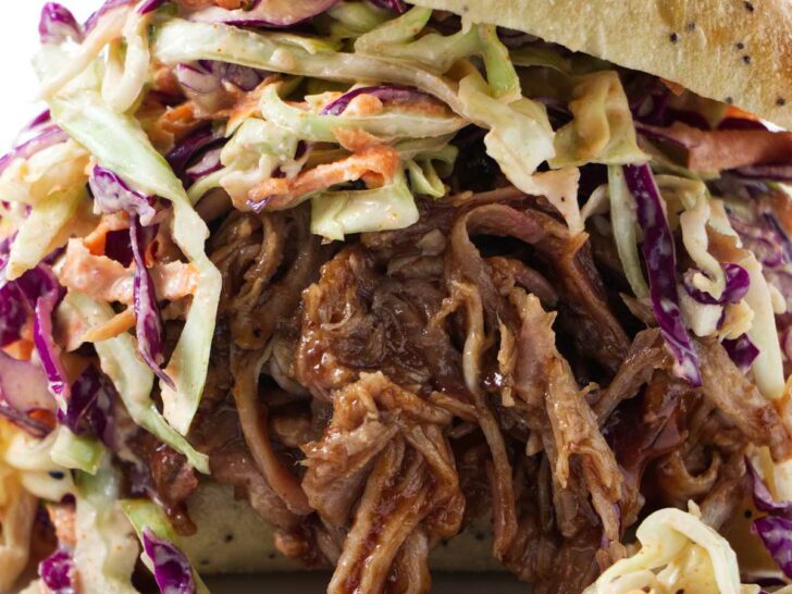 A sandwich made with bbq pulled pork in crock pot.