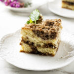 A slice of sourdough discard coffee cake with a crumb topping.