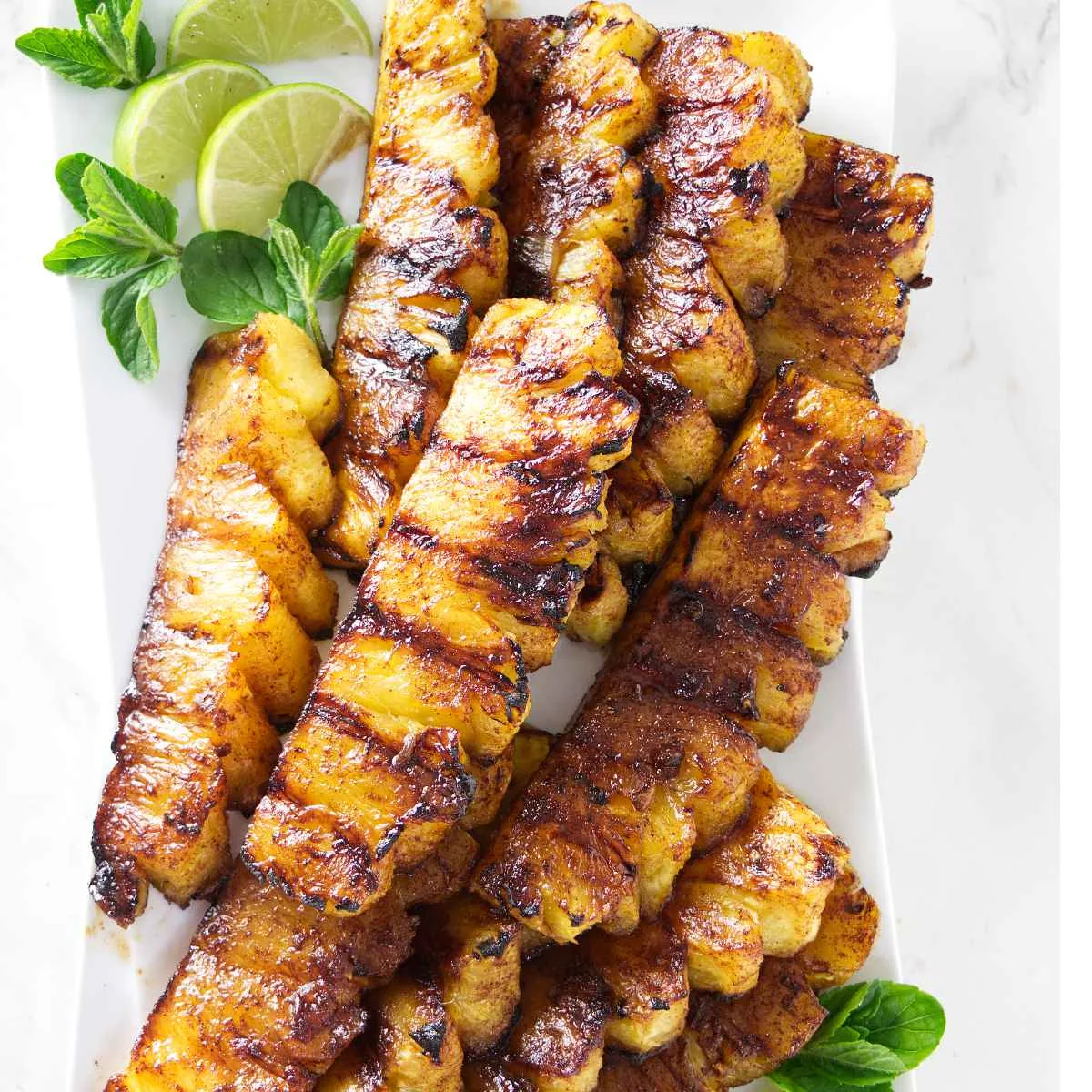 Cinnamon sugar grilled pineapple on a platter.