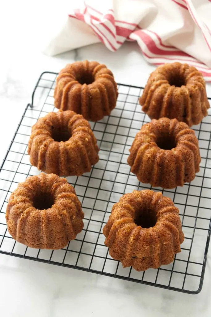 Cooling the mini bundt cakes on a wire rack.