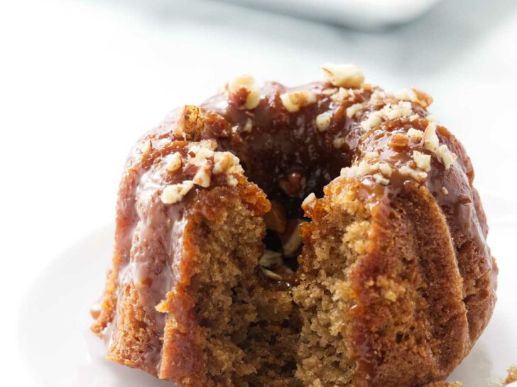 A fork next to a mini apple bund cake.