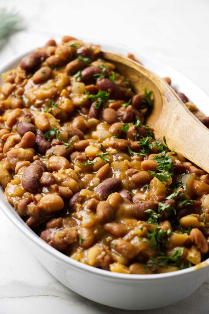 Crockpot baked beans in a serving dish.