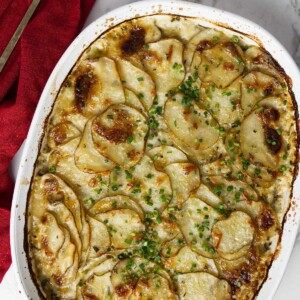 A baking dish with rosemary parmesan potatoes gratin.