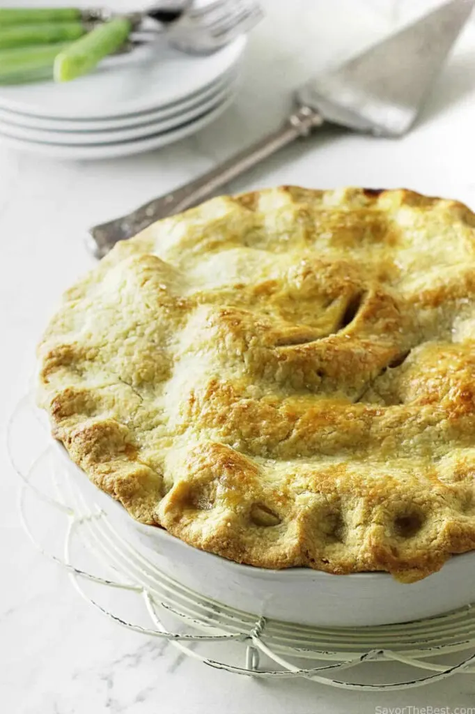 Golden brown einkorn pie crust on top of a fruit pie.