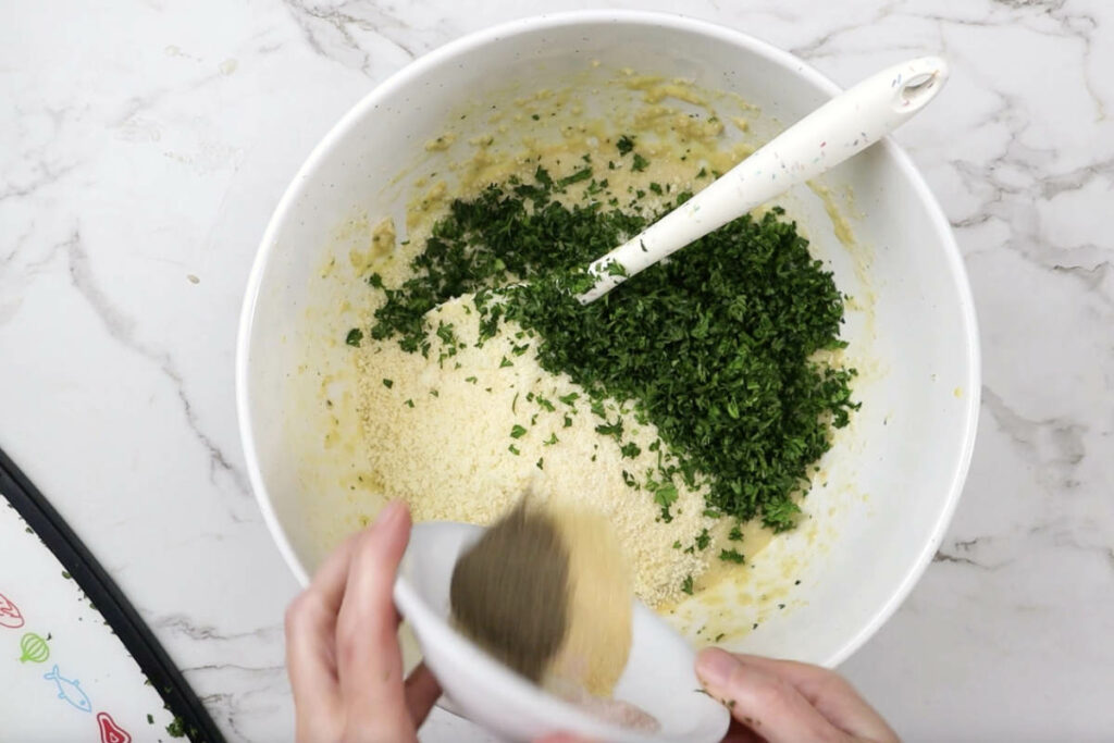 Adding seasoning to the panade.