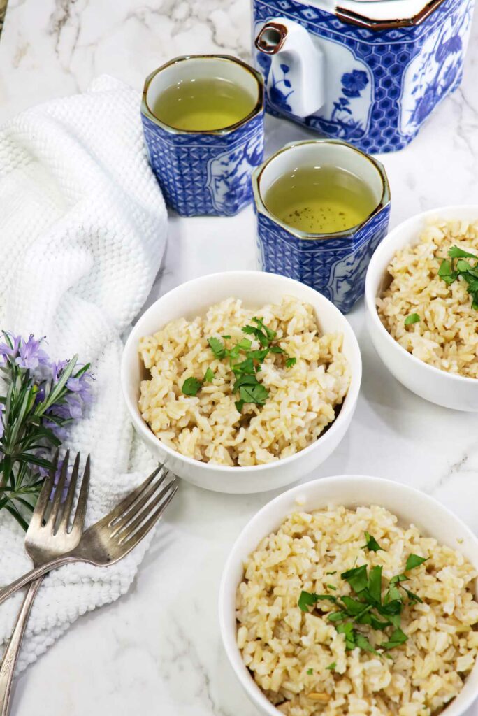 Several servings of germinated brown rice next to a white dish towel.