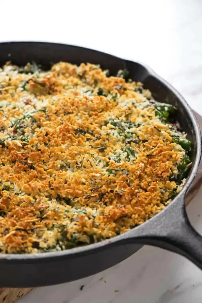 A skillet with a fresh green bean casserole.