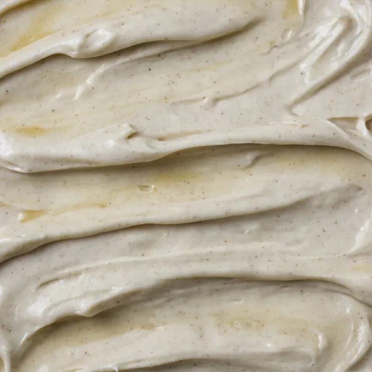 A swirl of maple cream cheese frosting on the top of a cake.