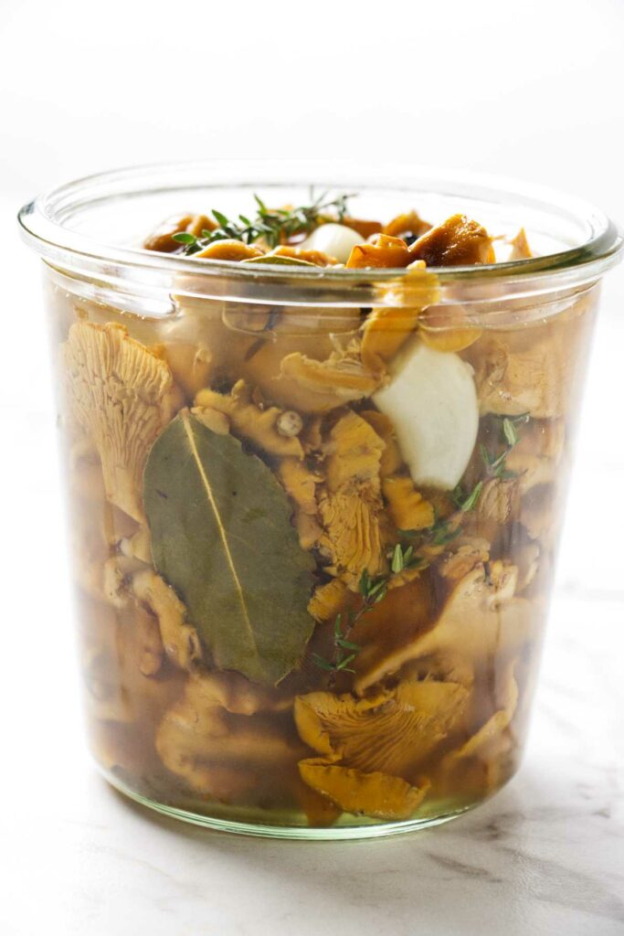 A jar of pickled marinated chanterelles.