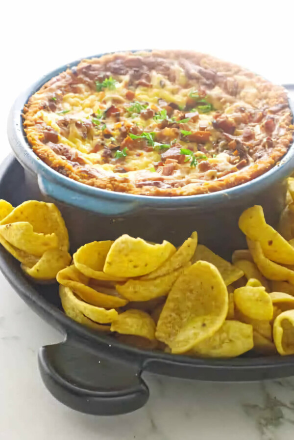 Smoked bean and bacon dip in a warm dish.