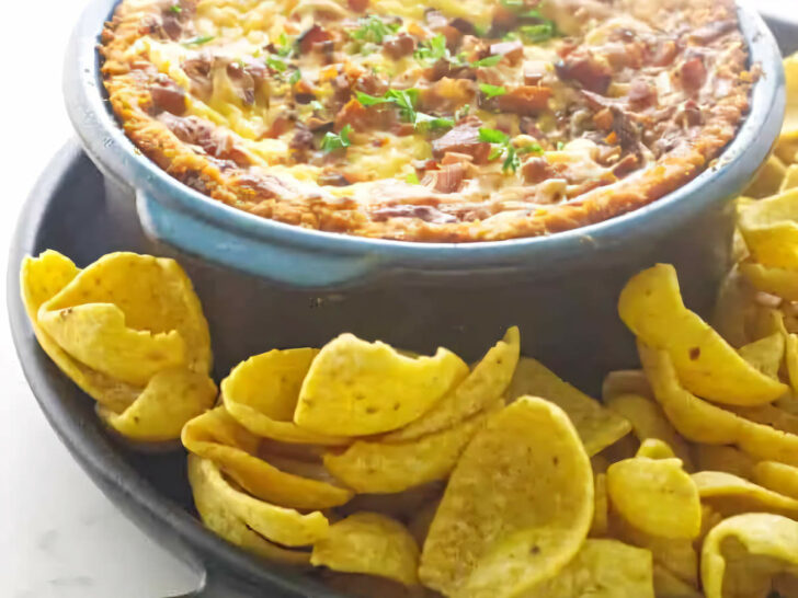 Smoked bean and bacon dip in a warm dish.